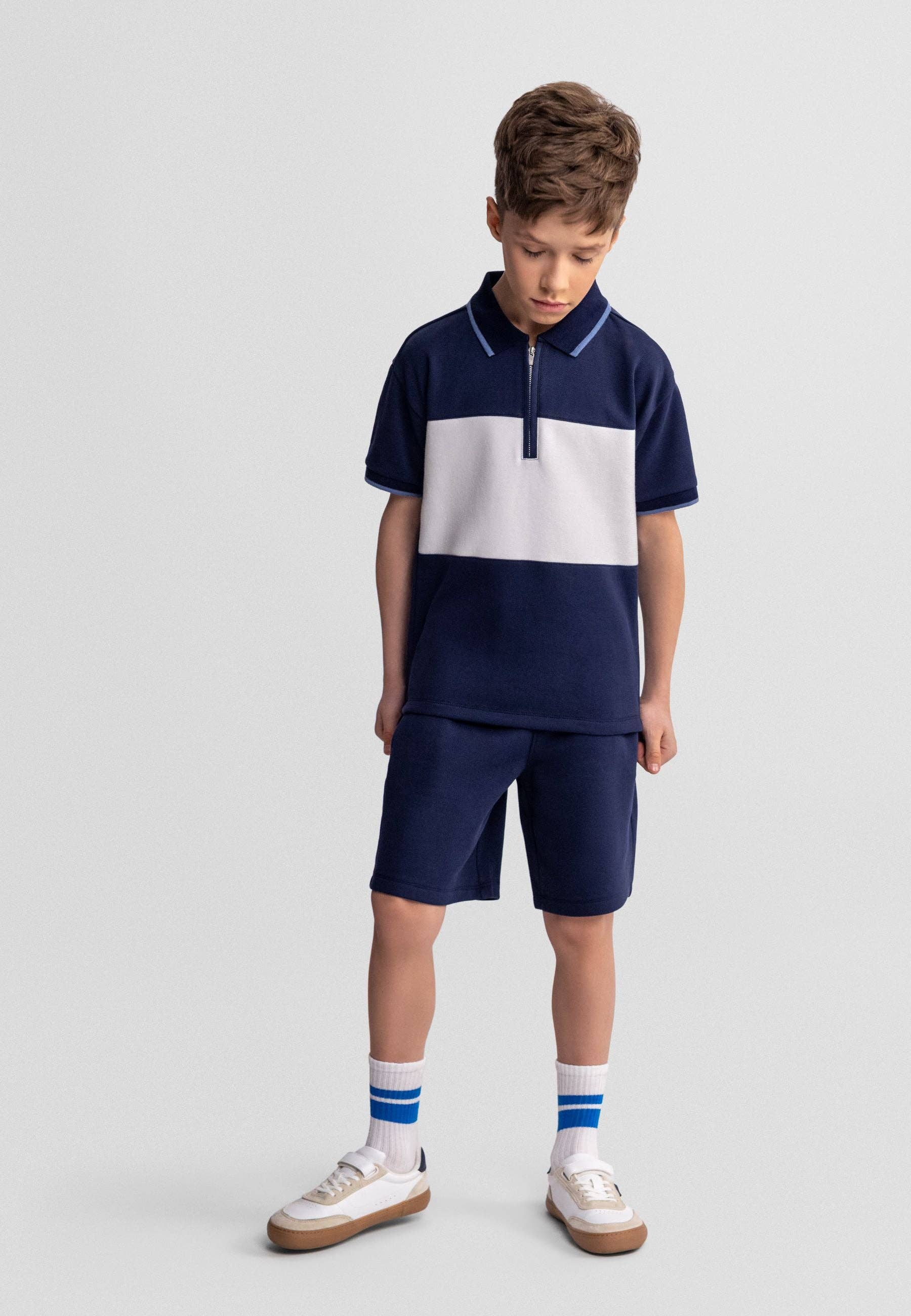 Donkerblauwe jongens set met polo en korte broek Minoti