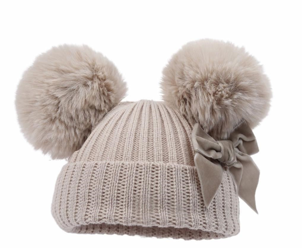 Beige gebreide babymuts met pompons – Elisa Kids Boutique