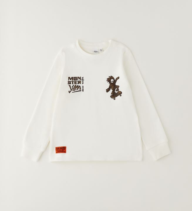 Gebroken wit iDO jongens longsleeve met skateboardprint – vooraanzicht