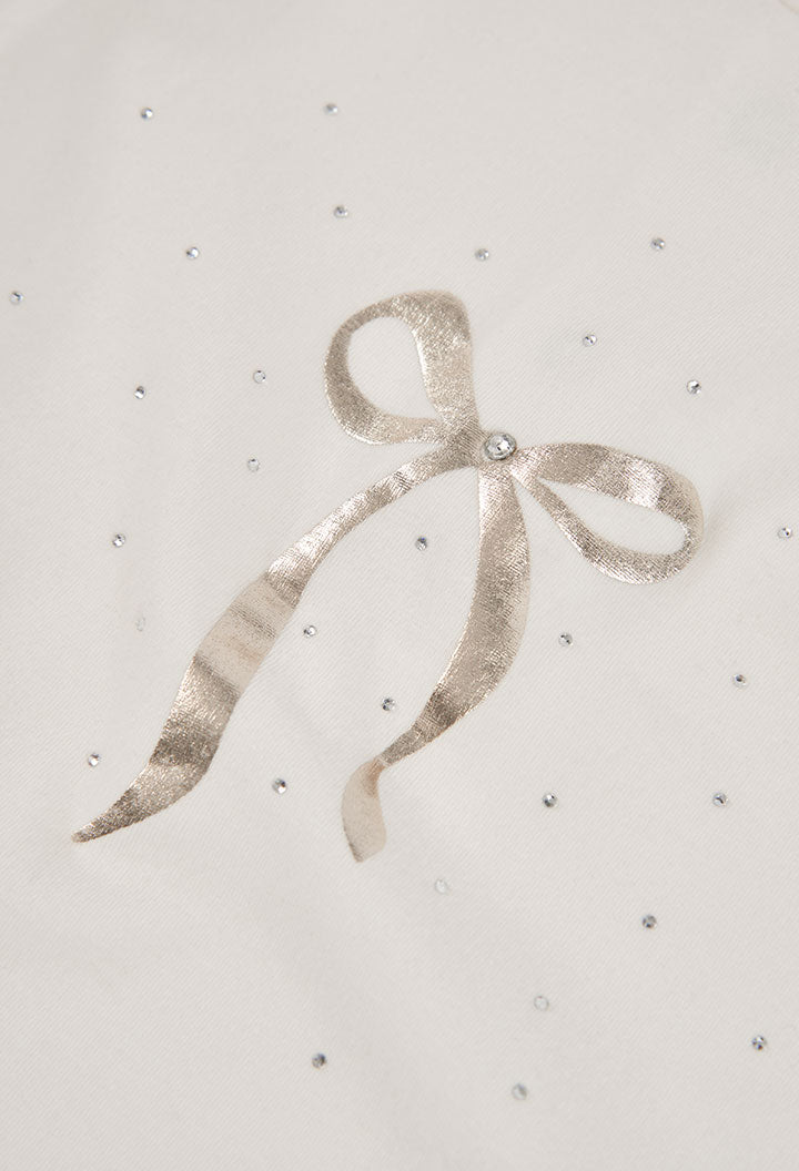 detail van de gouden strikprint met glittersteentjes op de Boboli meisjeslongsleeve