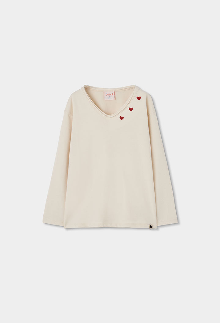 Ecru Boboli longsleeve voor meisjes met rode hartjes langs de V-hals
